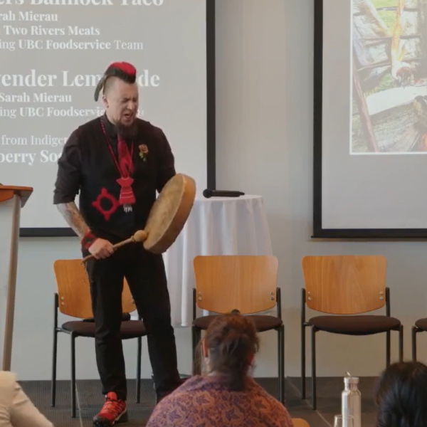 Qwustenuxun playing a drum